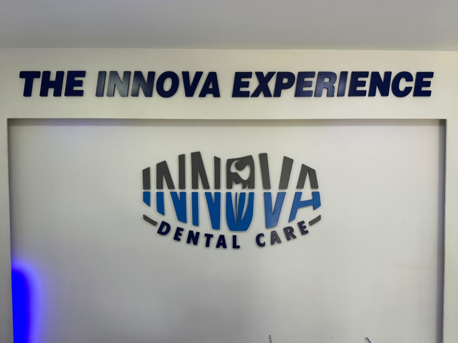 The Innova Experience wall and Innova Dental Care logo